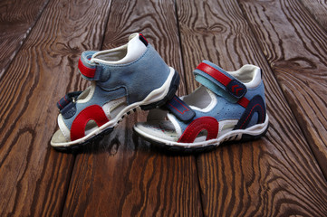 Child's sandals on a wood