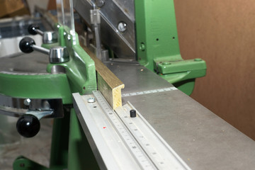 Craftsman working on frame in frameshop.