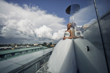 excellent  bride stand on the roof of the building