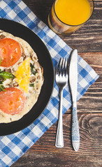 Omelet with tomatoes, parsley and feta cheese