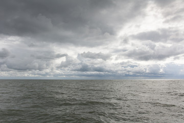 Fototapeta na wymiar Nordic sea - moody sky and heavy clouds