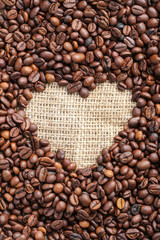 Brown roasted coffee beans on sackcloth