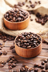 Roasted coffee beans on a brown wooden table