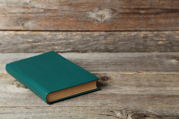 Old book on a grey wooden table