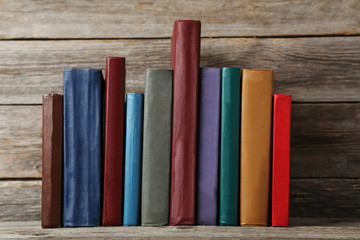 Old antique books on grey wooden table