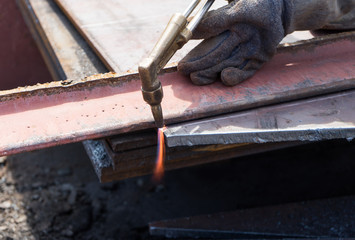 worker cutting steel using metal torch