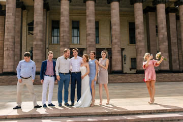 Lovely photo of the newlyweds and their friends together