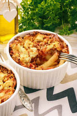 Pastitsio -greek casserole with pasta, meat, tomatoes and feta cheese.