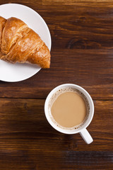 Latte cup and croissant
