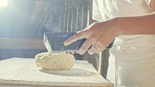 Form for baking bread in the hands of the young baker