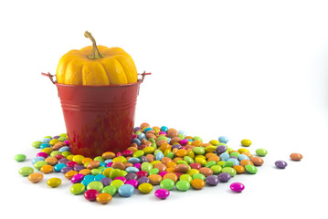  pumpkin in bucket and candy colorful