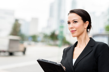 Fototapeta premium Businesswoman with Digital Tablet Computer Outdoors Downtown
