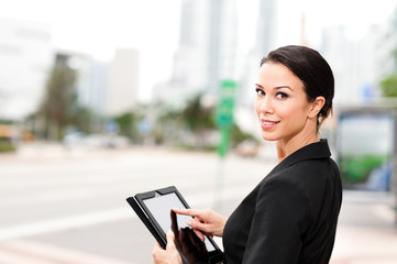 Businesswoman with Digital Tablet Computer Outdoors Downtown