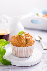 Delicious homemade coconut cinnamon muffin on marble coasters. Healthy food concept with copy space.