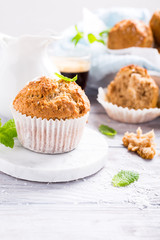 Delicious homemade coconut cinnamon muffin on marble coasters. Healthy food concept with copy space.