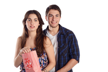 Naklejka premium Young couple watching a movie and eating popcorn.
