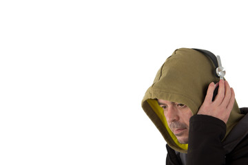 Man in hoodie listening to headphones