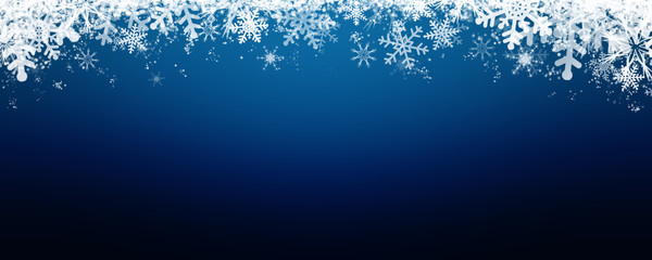 Blue winter background with snow and snowflackes.