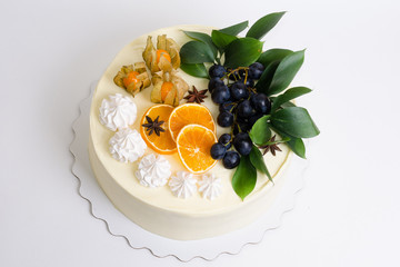 Vanilla cream cheese cake with grapes and oranges