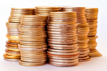 Coins stacked in bars . The concept of market instability