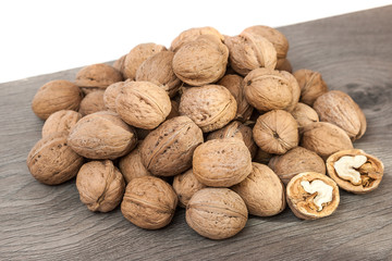 Group of walnuts on wooden surface. Natural health food