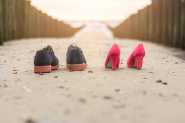 Wedding shoes at the beach in the sand