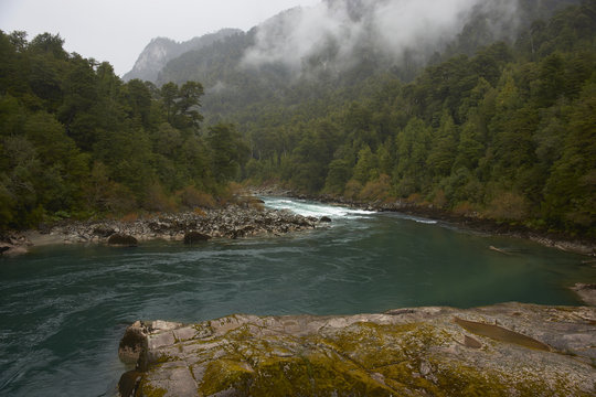 River Futaleufu flowing through mist shrouded forests in the Aysen Region of southern Chile. The river is renowned as one of the premier locations in the world for white water rafting.
