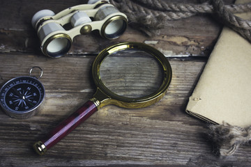 Compass rope and other items on the wooden background