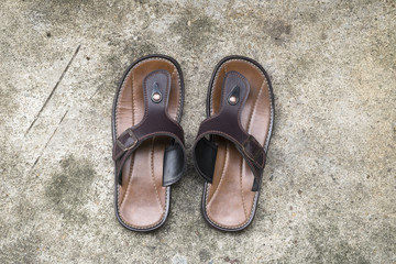 Leather sandals on Concrete background