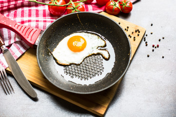 Breakfast with fried egg and vegetables