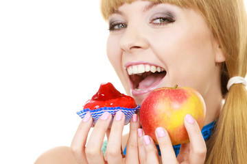 Woman choosing fruit or cake make dietary choice