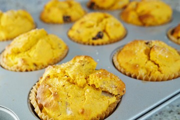 Tray of homemade vegan pumpkin muffins with pears and dried cherries