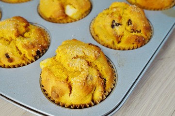 Tray of homemade vegan pumpkin muffins with pears and dried cherries