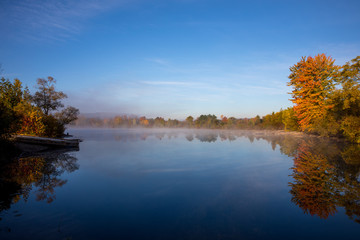 Autumn colours with lake reflection