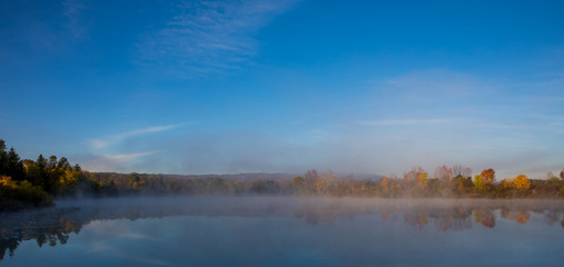 Autumn colours over misty lake 2