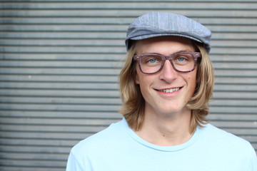 Portrait of young man in office smiling
