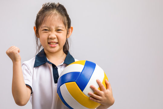 Child Holding Volleyball, Isolated on White