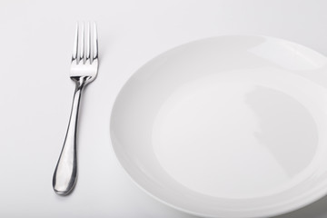 Plate knife and fork on the white