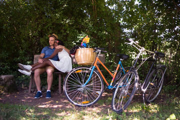 Obraz premium Young multiethnic couple having a bike ride in nature