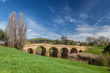 Fototapeta na wymiar The iconic Richmond Bridge on bright sunny day. Richmond, Tasmania, Australia