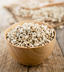 Millet the organic grain food in wood bowl on wood table