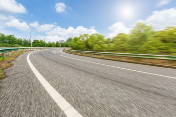 Fuzzy motion asphalt road under the blue sky