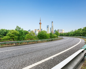 asphalt road and Shanghai skyscraper city scenery ,in China