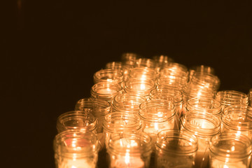 The flame of the candle and black scenery