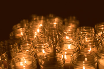 The flame of the candle and black scenery