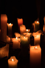 The flame of the candle and black scenery