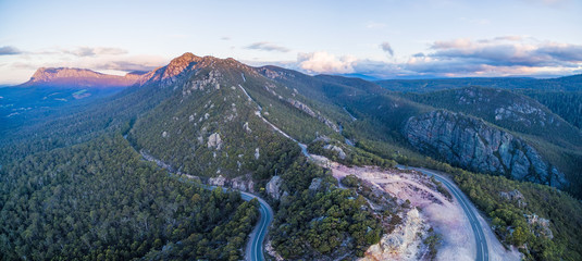 Aerial panorama of Mount Roland Regional Reserve and Olivers road at sunset. Mount Roland,...