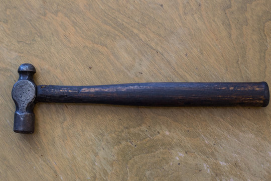 Old Antique Hammer On Wooden Table