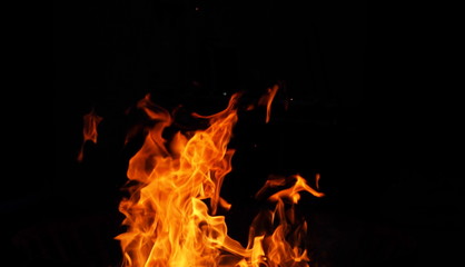 Night outdoor photography of the burning wood and flame
