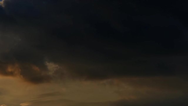 Dark sky cloudscape time-lapse 4k nature video: clouds moving on night evening twilight. Day to night transition 